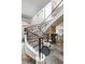 Sweeping staircase featuring dark ornate rails and large tile flooring in the entryway at 560 Dutch Valley Ne Rd # 209, Atlanta, GA 30324