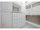 Spacious walk-in closet with built-in cabinets and shelves, providing ample storage options at 560 Dutch Valley Ne Rd # 209, Atlanta, GA 30324