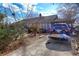 Front view of the house with a driveway and landscaping at 141 Hill St, Roswell, GA 30075