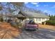 House with a carport and a spacious backyard at 141 Hill St, Roswell, GA 30075