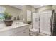 Clean bathroom with double vanity and walk-in shower at 2092 Moss Hill Road, Stone Mountain, GA 30088