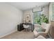 Bright and airy home office with a modern desk setup, window views, and a comfortable chair at 2094 Moss Hill Road, Stone Mountain, GA 30088