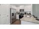 Modern kitchen featuring stainless steel appliances and granite countertops at 2094 Moss Hill Road, Stone Mountain, GA 30088