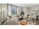 Spacious living area featuring a large window, hardwood floors, and comfortable seating at 2094 Moss Hill Road, Stone Mountain, GA 30088