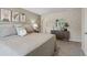 Inviting main bedroom with a dresser, stylish decor, a plush bed, and soft carpet at 2094 Moss Hill Road, Stone Mountain, GA 30088