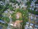 Aerial view of the property showcasing its location within a leafy residential area and its surrounding trees at 72 Bishop Nw Dr, Cartersville, GA 30121