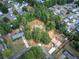 The aerial view highlights the property's setting amidst mature trees in a quiet, suburban neighborhood at 72 Bishop Nw Dr, Cartersville, GA 30121