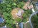 Aerial view of a charming home nestled among lush trees and greenery at 72 Bishop Nw Dr, Cartersville, GA 30121