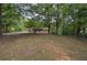 Spacious backyard and home with a serene setting surrounded by mature trees at 72 Bishop Nw Dr, Cartersville, GA 30121