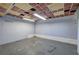 Unfinished basement space with concrete floors, painted walls, and dropped ceiling at 72 Bishop Nw Dr, Cartersville, GA 30121