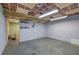 Unfinished basement space with concrete floors, painted walls, and dropped ceiling at 72 Bishop Nw Dr, Cartersville, GA 30121