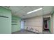Unfinished basement space with concrete floors, green painted walls, and storage shelves at 72 Bishop Nw Dr, Cartersville, GA 30121