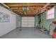 Spacious basement with exposed ceiling and a large garage door, offering lots of potential at 72 Bishop Nw Dr, Cartersville, GA 30121