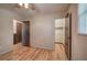 Bedroom with wood-look flooring, ceiling fan, and closet at 72 Bishop Nw Dr, Cartersville, GA 30121