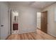 Bedroom with hardwood flooring and view into the bathroom and closet at 72 Bishop Nw Dr, Cartersville, GA 30121