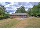 Charming single-story brick home with a well-maintained lawn and a lovely curb appeal at 72 Bishop Nw Dr, Cartersville, GA 30121