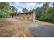 Brick home with a charming covered porch, complemented by a long driveway at 72 Bishop Nw Dr, Cartersville, GA 30121