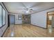 Open living room with hardwood floors, stone accent wall, and access to the kitchen at 72 Bishop Nw Dr, Cartersville, GA 30121