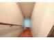 View down a stairway with orange carpet leading to a lower level or basement at 72 Bishop Nw Dr, Cartersville, GA 30121