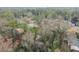 Aerial view of the neighborhood with mature trees, various home styles, and a glimpse of the surrounding community at 4540 Club Valley Ne Dr, Atlanta, GA 30319