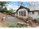 Brick patio and rear exterior of home with mature trees at 4540 Club Valley Ne Dr, Atlanta, GA 30319