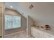 Bright attic bathroom with tiled floors, vanity and natural lighting at 4540 Club Valley Ne Dr, Atlanta, GA 30319