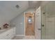Bright attic bathroom with tiled floors and shower at 4540 Club Valley Ne Dr, Atlanta, GA 30319