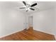 Neutral bedroom featuring hardwood floors, ceiling fan, closet and a doorway to another room at 4540 Club Valley Ne Dr, Atlanta, GA 30319