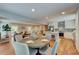 Open dining area with access to living room and kitchen, hardwood floors, and light gray walls at 4540 Club Valley Ne Dr, Atlanta, GA 30319
