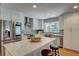 Modern kitchen boasts stainless steel appliances, quartz countertops, a central island with seating, and ample cabinet space at 4540 Club Valley Ne Dr, Atlanta, GA 30319