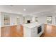 Kitchen island overlooking the living area with a fireplace and natural lighting at 4540 Club Valley Ne Dr, Atlanta, GA 30319