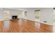 Living room with a fireplace, hardwood flooring, and a large window at 4540 Club Valley Ne Dr, Atlanta, GA 30319
