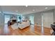 Inviting living room filled with natural light, a charming fireplace, and beautiful hardwood flooring at 4540 Club Valley Ne Dr, Atlanta, GA 30319
