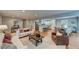 Open-concept living space featuring hardwood floors, neutral decor, and seamless transition to the kitchen at 4540 Club Valley Ne Dr, Atlanta, GA 30319