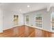 Bright open space with hardwood flooring, white walls and trim, and large windows at 4540 Club Valley Ne Dr, Atlanta, GA 30319