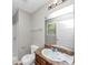 Well-lit bathroom features a vanity, shower, toilet, and a large mirror over the sink at 1016 Weatherwood Pl, Conyers, GA 30012