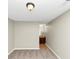 Bedroom with plush gray carpeting, neutral walls, and easy access to an adjacent bathroom at 1016 Weatherwood Pl, Conyers, GA 30012