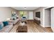 The staged living room has modern flooring, neutral walls, and a convenient entry door at 1016 Weatherwood Pl, Conyers, GA 30012