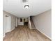 Open-concept living space features wood-look flooring, neutral paint, and a staircase to the right at 1016 Weatherwood Pl, Conyers, GA 30012