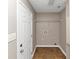 Room with brown tile flooring and a white door at 1016 Weatherwood Pl, Conyers, GA 30012