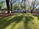 Expansive backyard with mature trees, green grass, and a wood privacy fence at 1929 Hazelwood Se Dr, Marietta, GA 30067