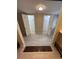 View of tiled flooring and two walk-in closets with open doors off of this bathroom at 1929 Hazelwood Se Dr, Marietta, GA 30067