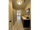 Well-lit bathroom featuring a modern vanity, ample storage, and a convenient shower area at 1929 Hazelwood Se Dr, Marietta, GA 30067