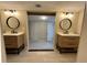Modern bathroom showcasing double sink vanity, tile floors, and round mirrors at 1929 Hazelwood Se Dr, Marietta, GA 30067