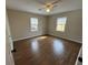 Bedroom with hardwood floors, a ceiling fan, and natural light from two windows at 1929 Hazelwood Se Dr, Marietta, GA 30067