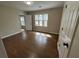 Cozy bedroom showcasing hardwood floors, large windows, and closet space at 1929 Hazelwood Se Dr, Marietta, GA 30067