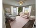 Bedroom featuring pink crib, hardwood floors, and plenty of natural light at 1929 Hazelwood Se Dr, Marietta, GA 30067