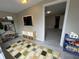 Cozy bonus room with tile floors, neutral paint, and a built-in entertainment center at 1929 Hazelwood Se Dr, Marietta, GA 30067