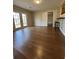 Spacious living room with beautiful hardwood floors and natural light streaming in from the French doors at 1929 Hazelwood Se Dr, Marietta, GA 30067