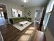 Inviting living room features stylish green seating, modern artwork, and gleaming hardwood floors at 1929 Hazelwood Se Dr, Marietta, GA 30067